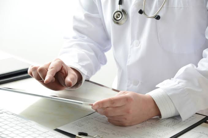 Clinical specialist analyzing cardiac biometric visualization
