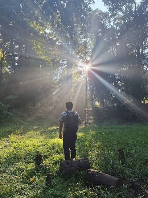 Man focusing during morning outdoor stretching