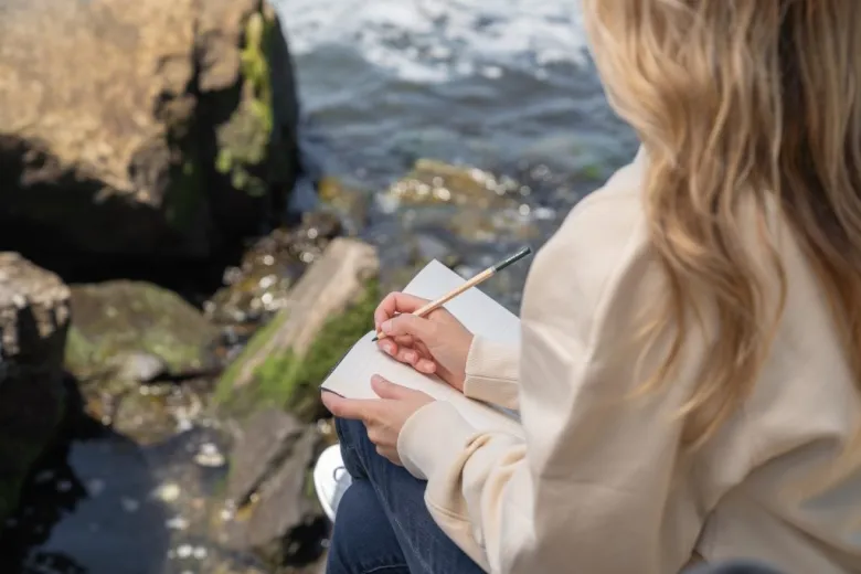 Individual taking deep breath in fresh outdoor air