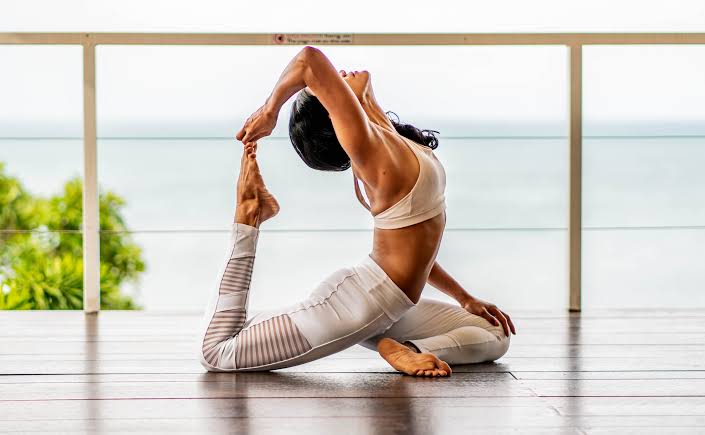 Person practicing gentle restorative yoga